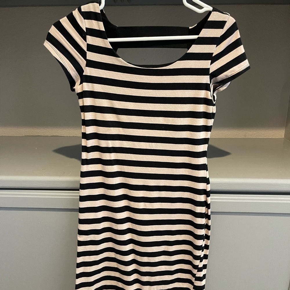 Adorable and form fitting Black and Tan striped dress, cute back detail!